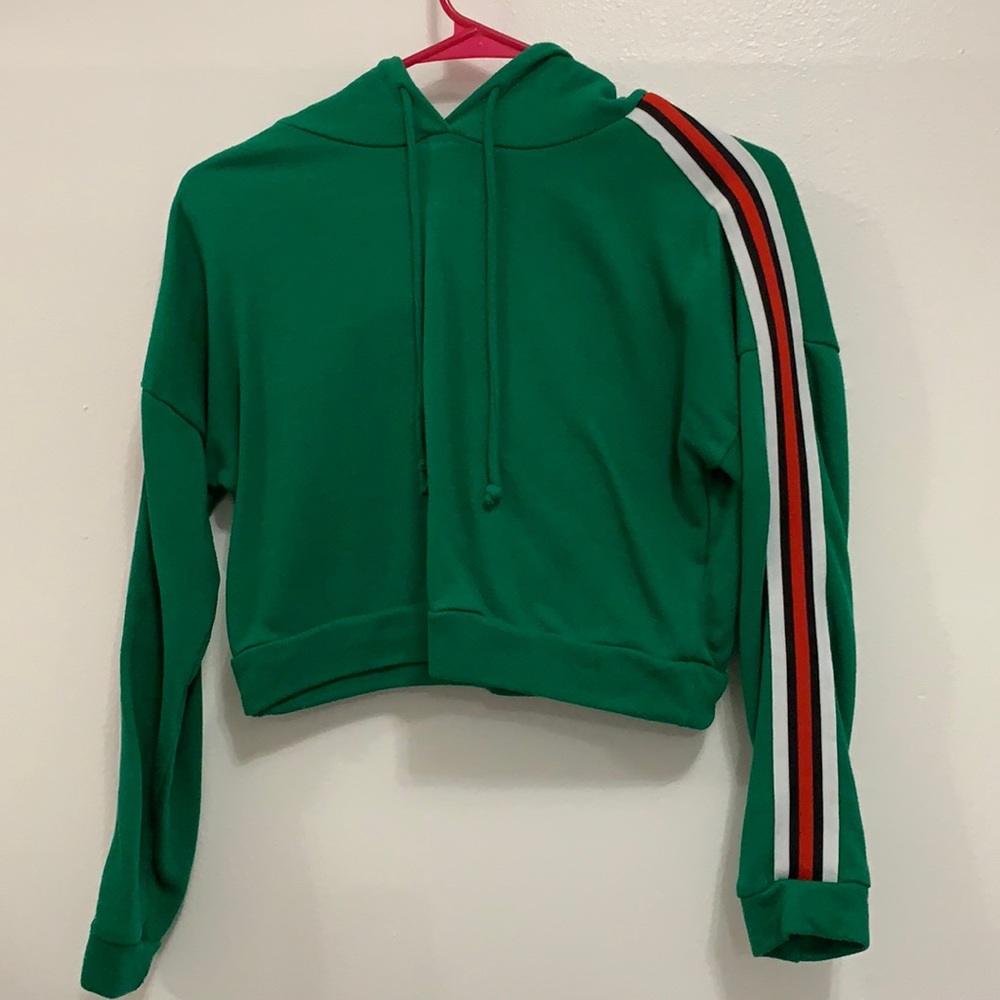 Green crop top with white red and black strip on sleeves